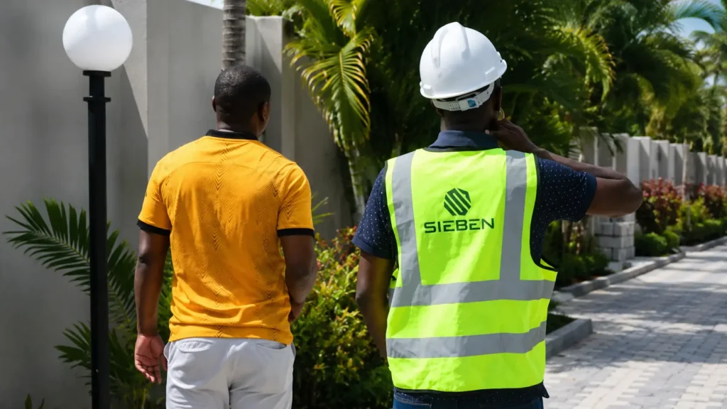 Sieben Construction engineer reviewing project plans when hiring a contractor in Zambia.
